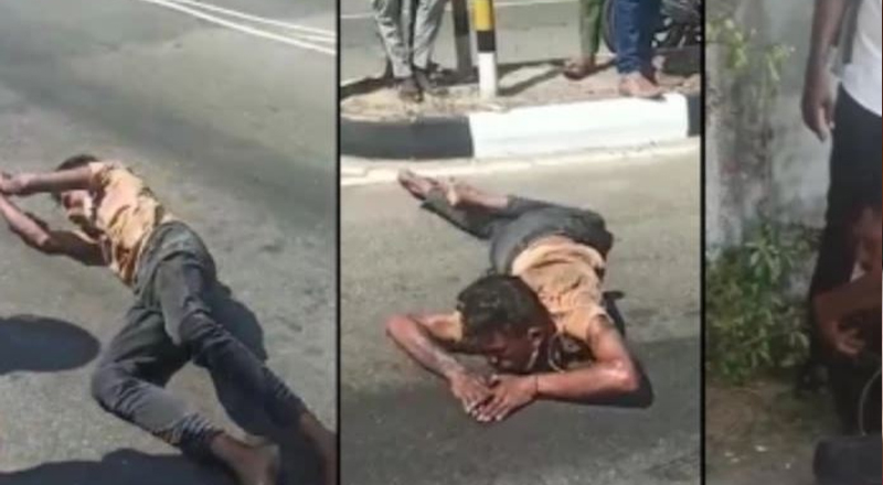மட்டக்களப்பு நகரில் பாம்பு போல் ஊர்ந்து சென்ற இளைஞன்